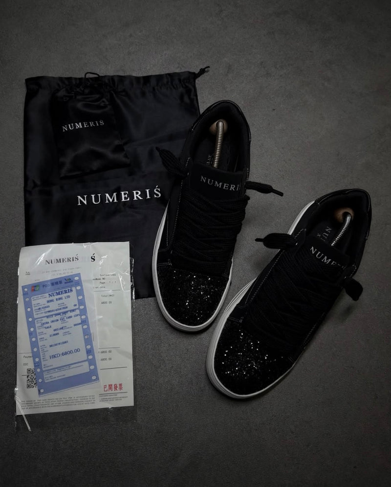 Numeris Atelier black sneakers.
