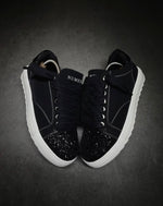 Numeris Atelier black sneakers.