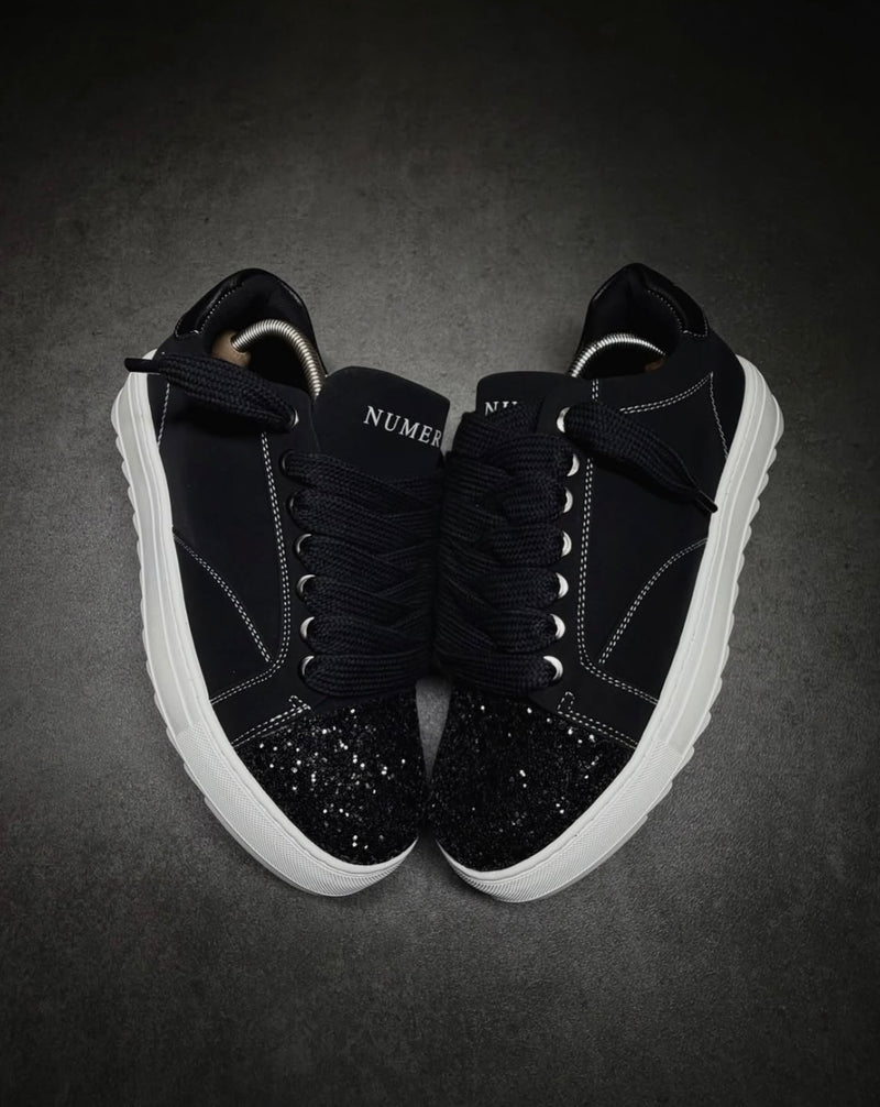 Numeris Atelier black sneakers.