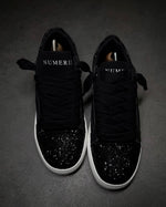 Numeris Atelier black sneakers.